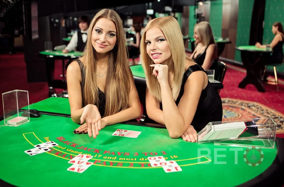 Tampilan ruang meja live dengan dealer dan area permainan